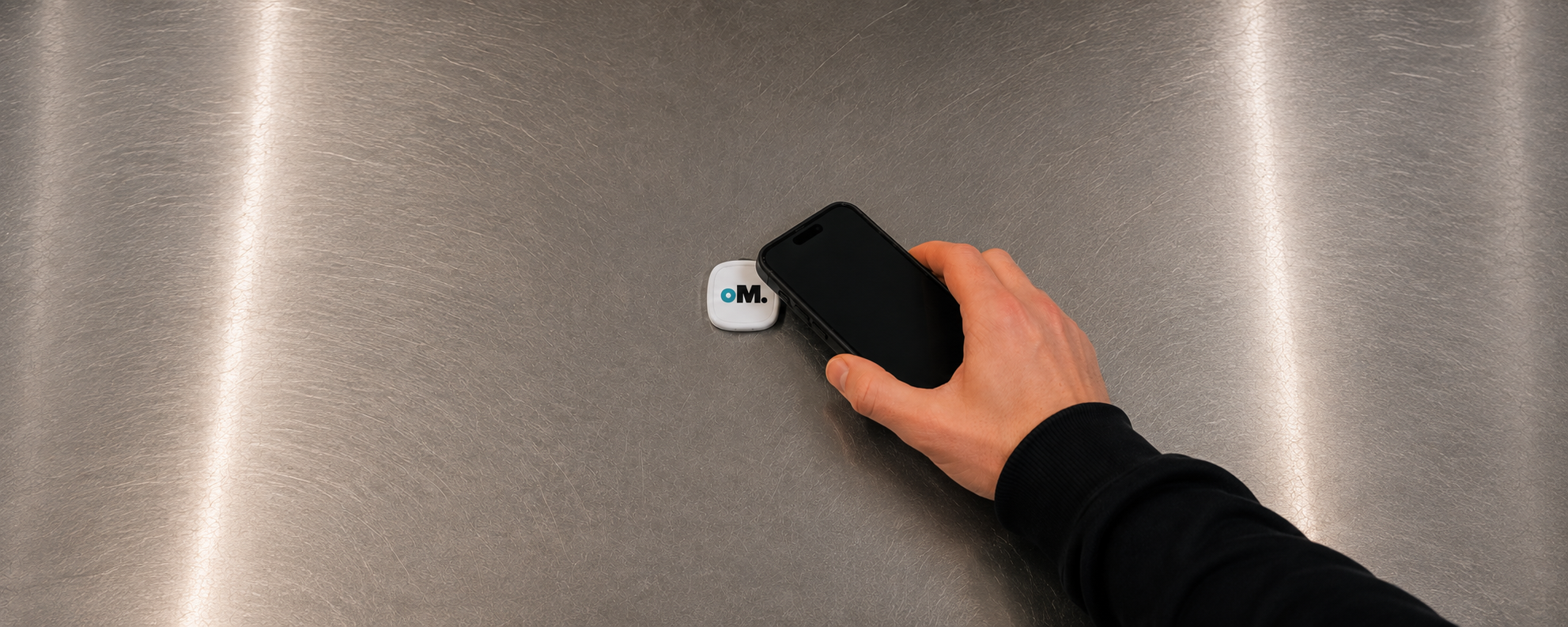 A server tapping a phone to the OptiMenu tag at the counter